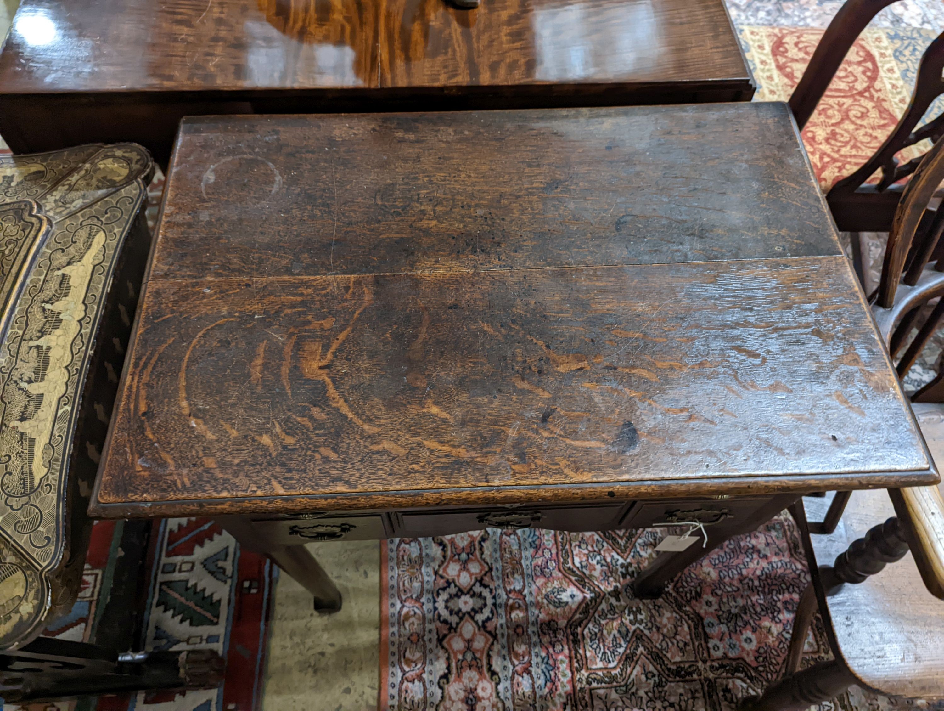 An 18th century oak lowboy. W-74cm, D-49cm, H-70cm.